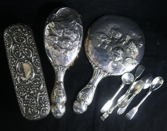 A silver mirror and two brushes decorated with Reynolds Angels and five plated spoons.